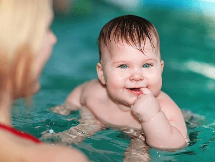 father and child in pool